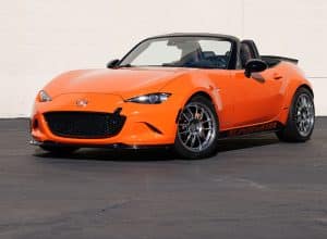Orange sports car parked outdoors.