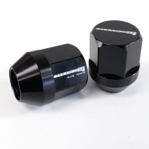 Black aluminum racing lug nuts on white background